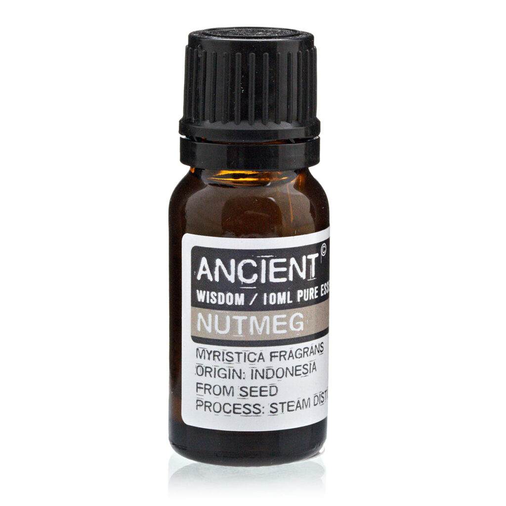 Amber glass essential oil bottle with black cap labeled 'Ancient Wisdom Nutmeg' and origin details on the label, used for fragrance or aromatherapy